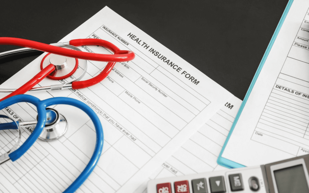 Health insurance form on table with stethoscope.